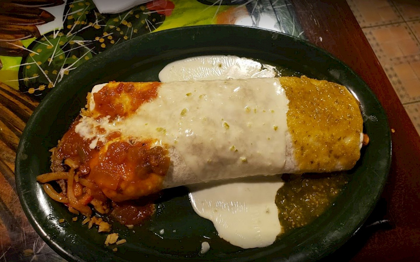 a burrito covered in cheese sauce