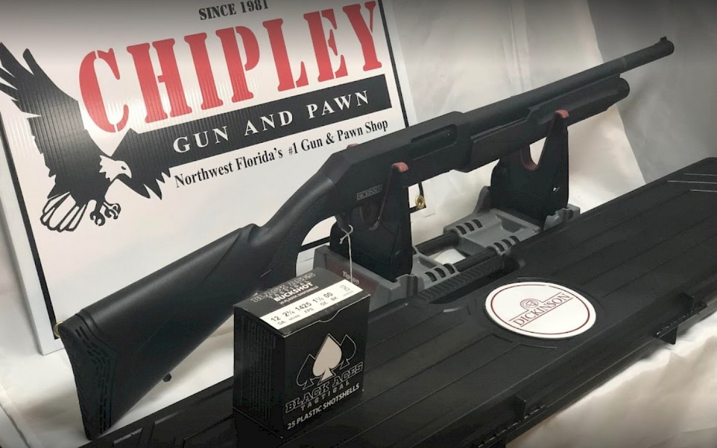 a shotgun on a display at chipley gun and pawn
