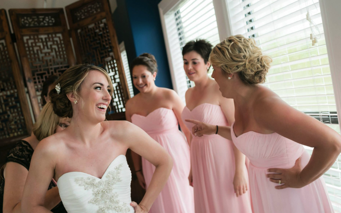 a bride, and her four brides maids with new hair styles, smiling