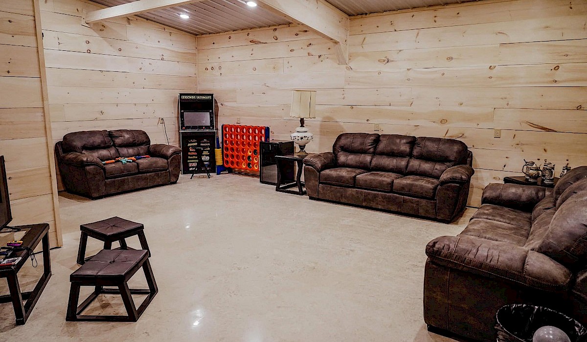 grooms dressing room at the barn venue with leather couches