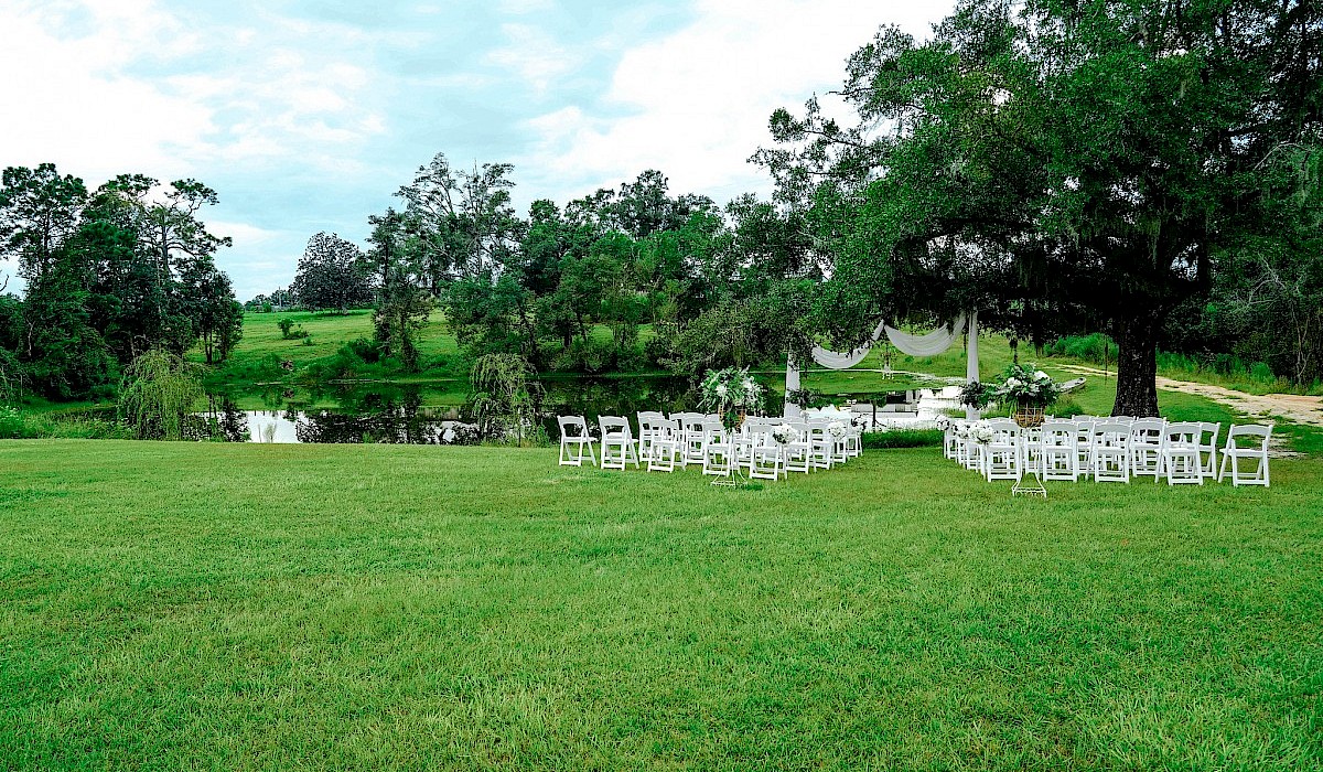 pond with chairs and altar at barn venue
