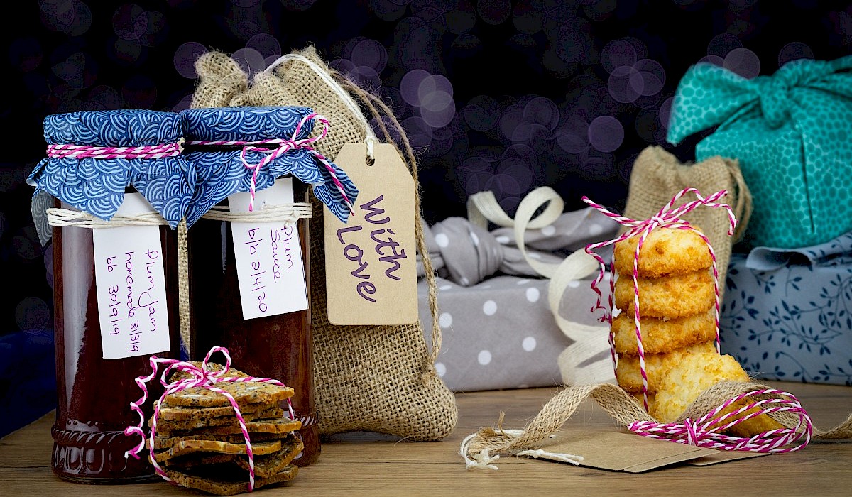 homemade Christmas gifts and treats arranged on a table