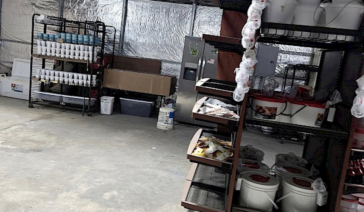 inside of bait shop showing shelving with fishing gear displayed