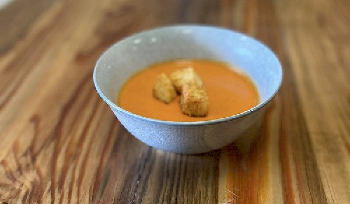bowl of soup sitting on sandwich shop table
